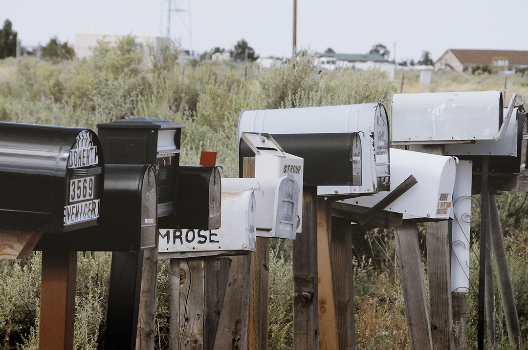 Line of mailboxes, showing a cluster of many properties in one small area found using virtual driving for dollars
